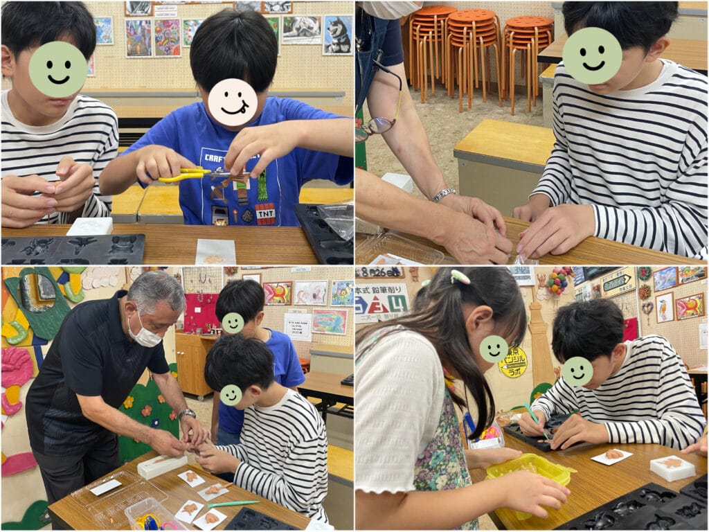 北星株式会社の工場見学施設内、「もくねんさん」ワークショップ。粘土体験中。