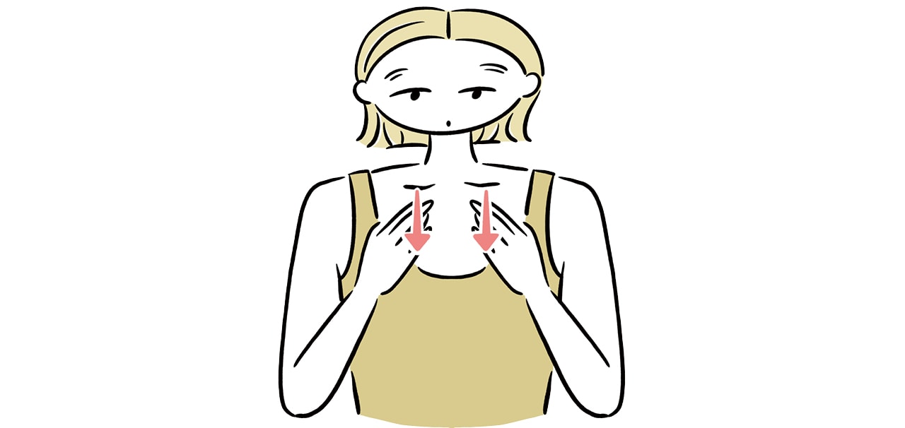 鎖骨の下に両手を添え、皮膚を軽く下に引く。