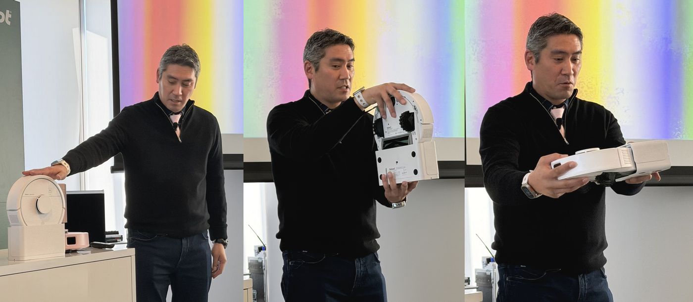 「Roomba Mini Slim 掃除機＆床拭きロボット+SlimCharge 充電スタンド」について説明する山田社長。普段は縦置きのスタンドに充電しておけて、横に倒せばそのまま掃除がスタートできます