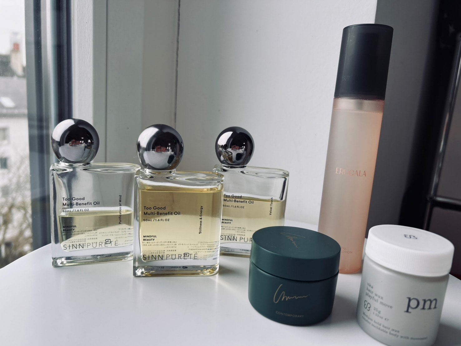 SINN PURETÉのヘアオイル（「Stillness & Energy」「Purification of Mind」「Velvet Touch」の３種類）、ununuのコンテンポラリー〈ヘア&ボディバーム〉、ERUCALAのフルフィル リペアローション